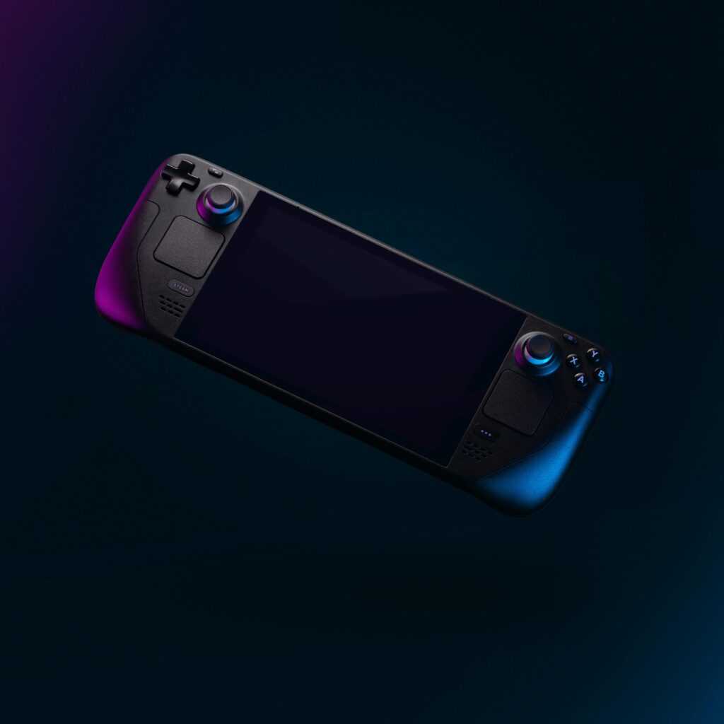 Elegant handheld gaming device with colorful backlighting against a dark backdrop.