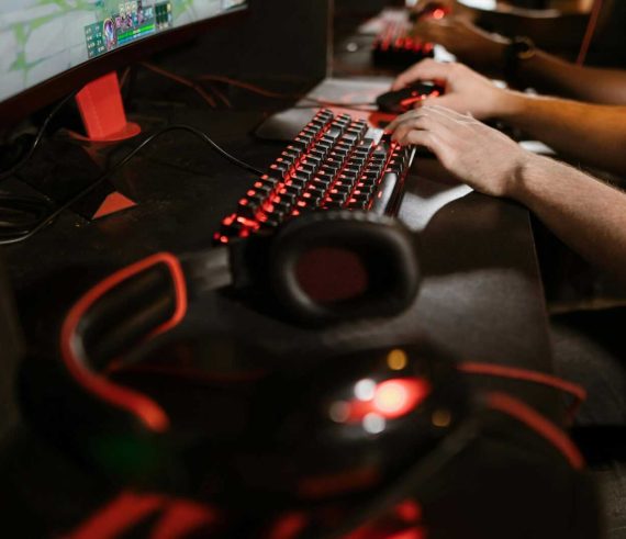 Close-up of gamers using mechanical keyboards during an intense esports session.